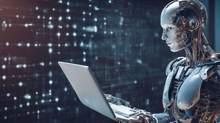 Robô humanoide utilizando notebook, representando inteligência artificial aplicada a negócios